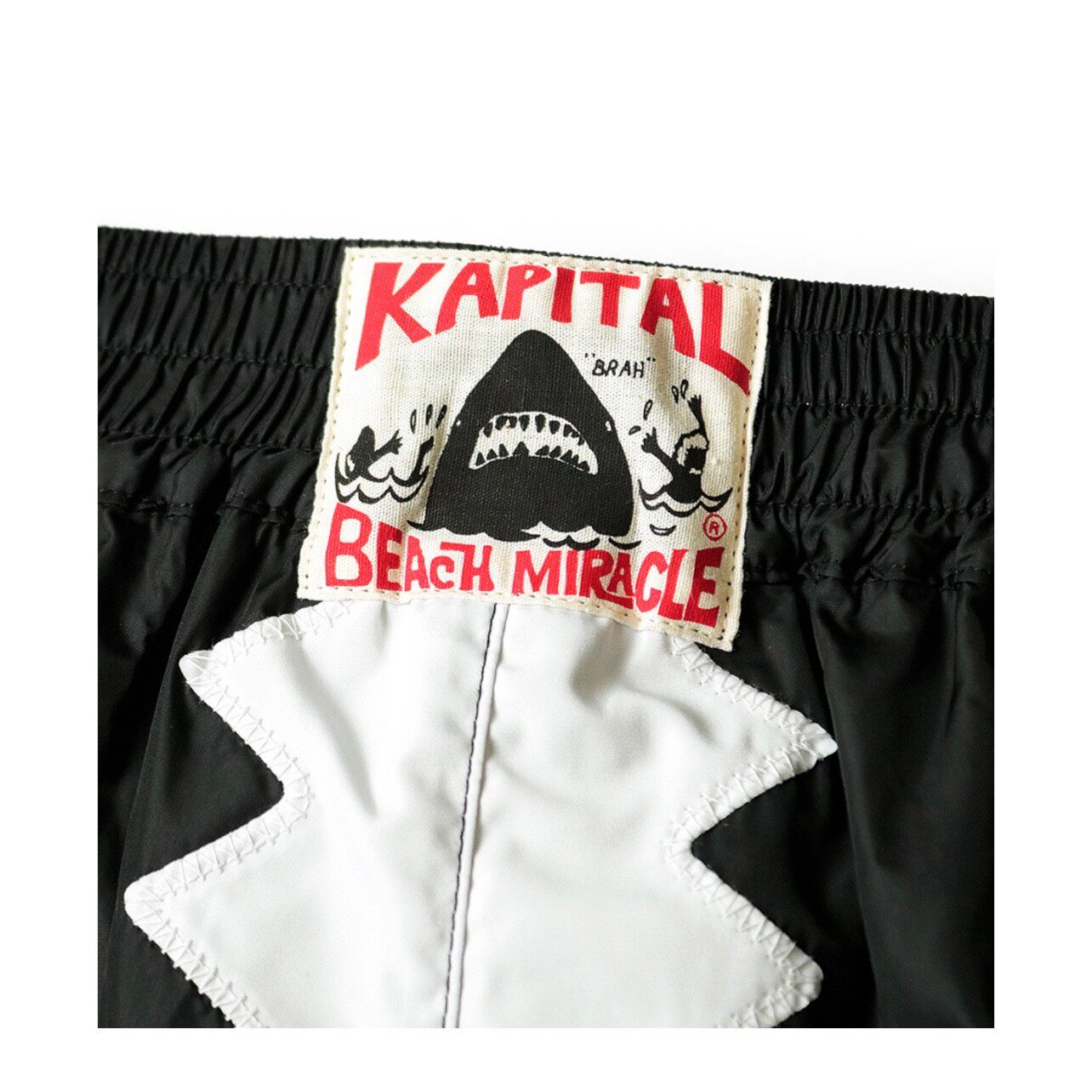 Pantalon décontracté en maille de nylon de style japonais avec taille élastique respirante et design à cinq poches