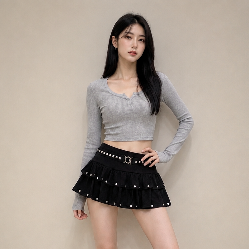 Mini-jupe noire taille basse à volants pour femme, avec ourlet superposé et détails cloutés, style Y2K streetwear, mignonne et décontractée