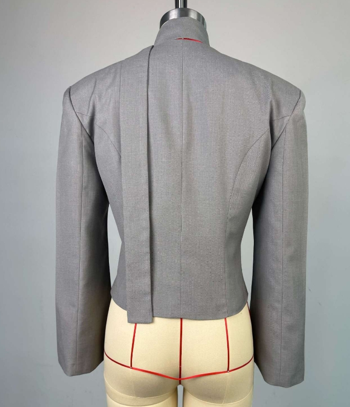 Veste femme 2025 printemps nouvelle mode couleur unie col en v écharpe décor tempérament élégant à manches longues jolie pochette