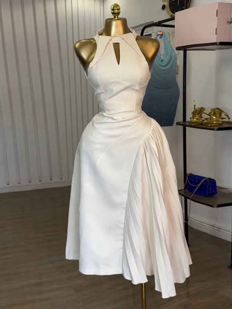 Robes mi-longues sans manches pour femmes, à la mode, asymétriques plissées et creuses, parfaites pour les cocktails ou les invités du mariage