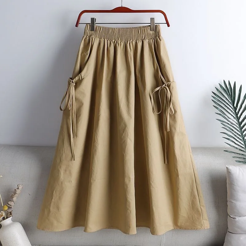 Jupe mi-longue élastique taille haute, style workwear, tendance été 2025, polyvalente, amincissante, avec ceinture et cordon de serrage, poches, longueur midi