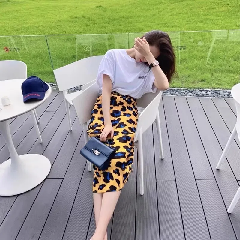 Jupe plissée taille haute pour femme, coupe ajustée, taille élastique, design asymétrique, jupe mi-longue ample en A pour l'été