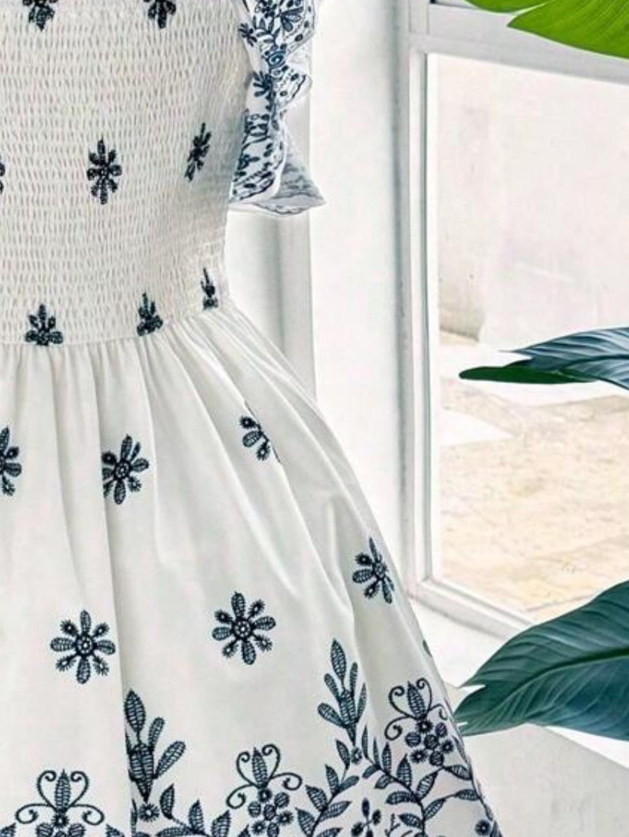 Robe élégante grande taille, imprimé ethnique tendance, design drapé raffiné et sophistiqué