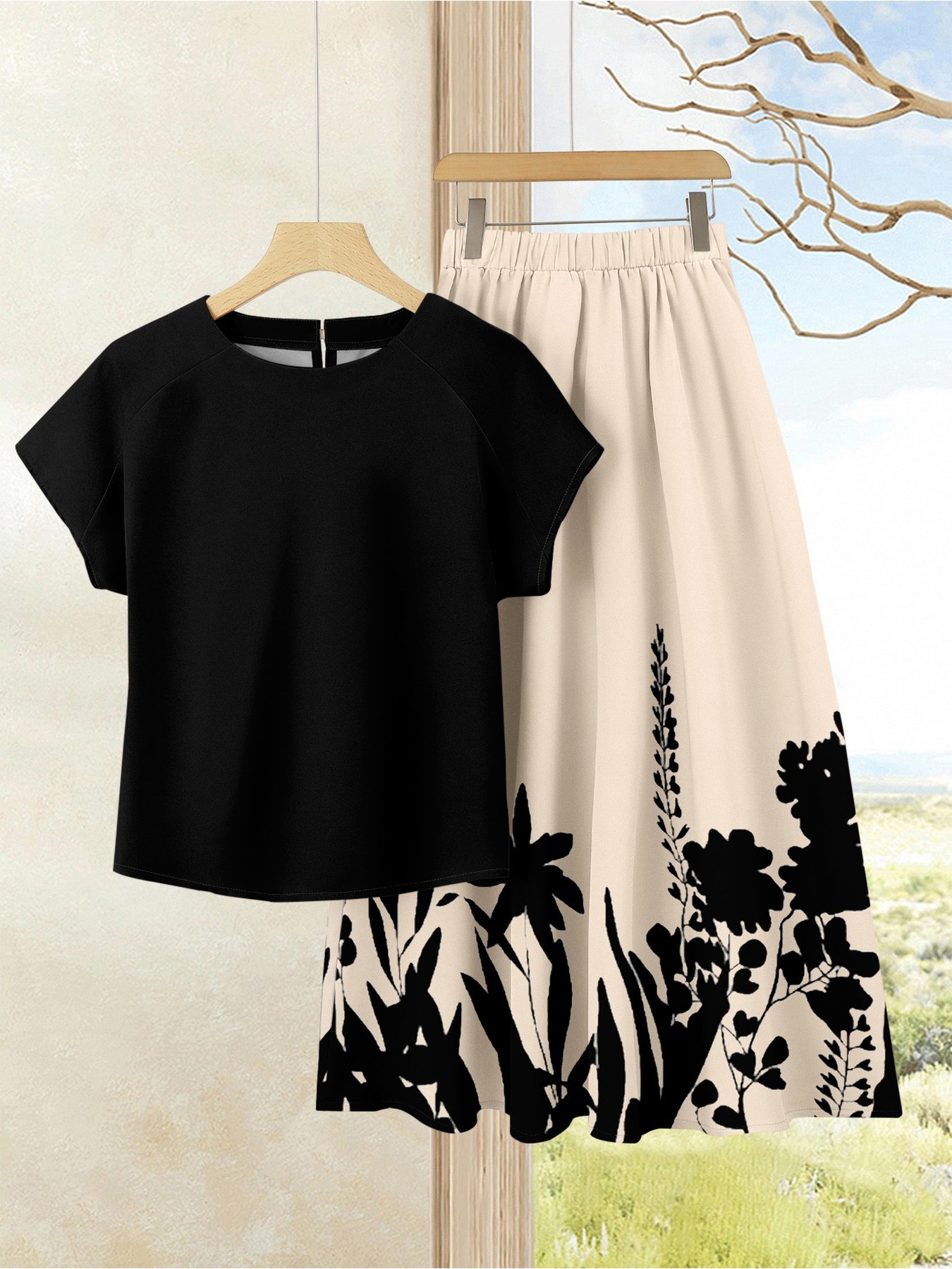 Ensemble deux pièces d'été pour femme grande taille, haut noir simple et ample tendance, et jupe mi-longue imprimée végétale, ensemble jupe évasée