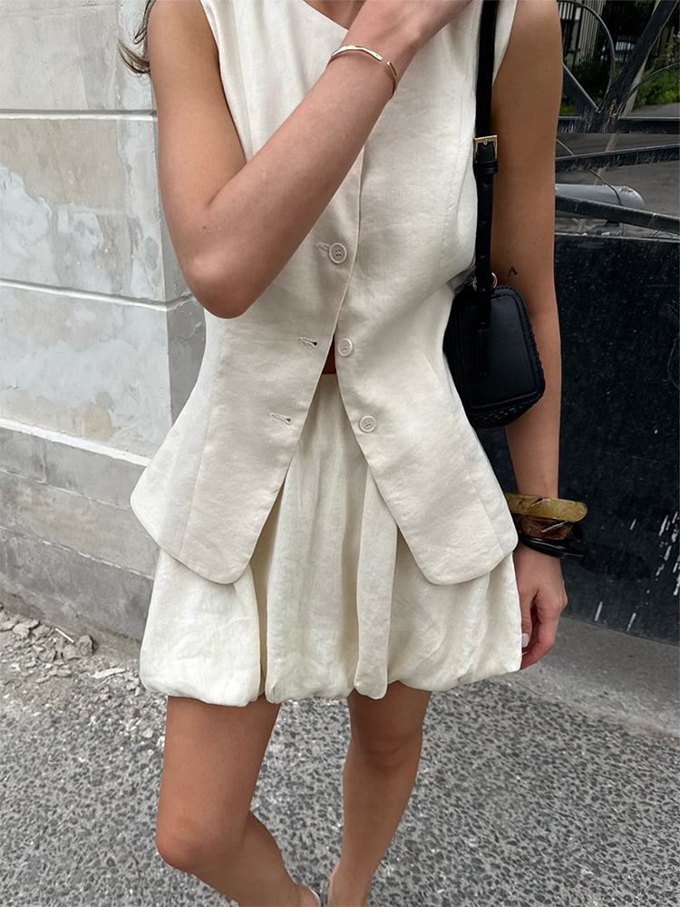 Ensemble 2 pièces pour femme en coton, été 2026, chic et décontracté pour le travail, comprenant un débardeur sans manches et une jupe courte à volants, tenue décontractée pour femme.