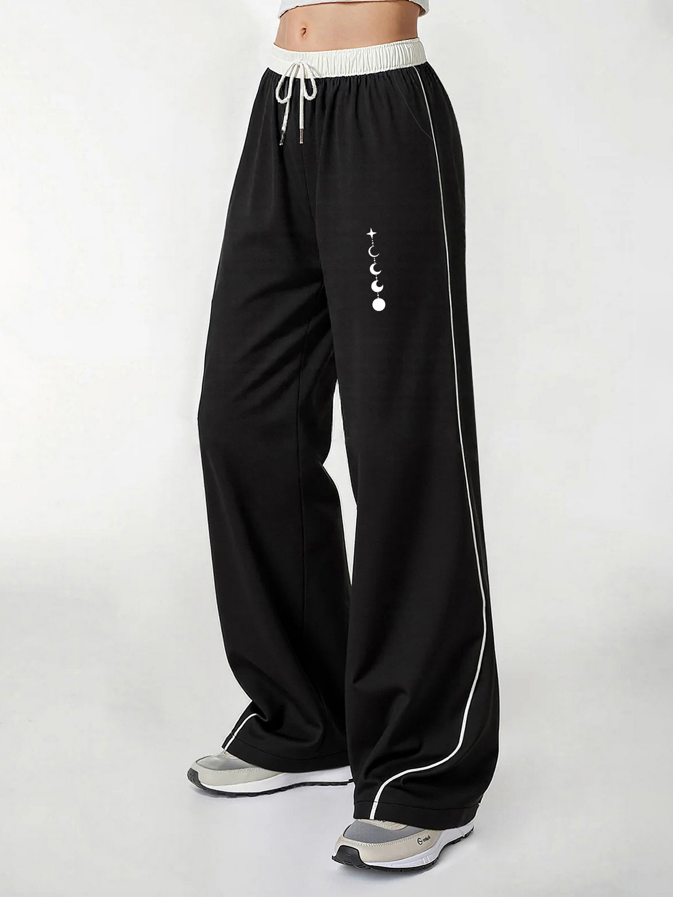 Pantalon décontracté pour femme, un incontournable pour un look tendance, pantalon décontracté d'été à jambe large avec imprimé phases de lune et trajectoire des étoiles, coupe ample avec un tombé fluide, confortable e