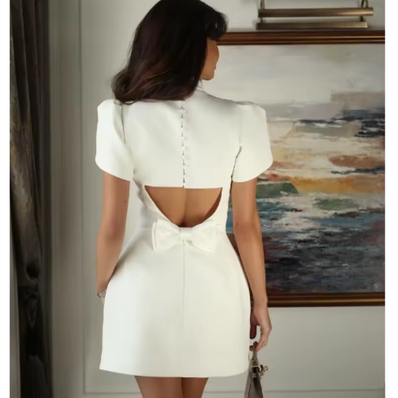 Mini jupe élégante à col mi-haut pour femme, robe de soirée blanche, nœud tridimensionnel, dos creux, robe courte, été