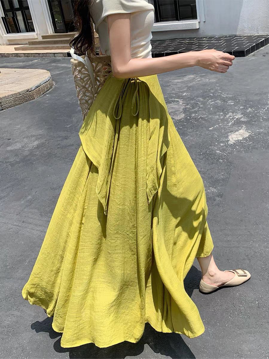 Nouvelle jupe longue évasée taille haute à nouer pour femme, style bohème fluide, collection été 2026, idéale pour couvrir les hanches