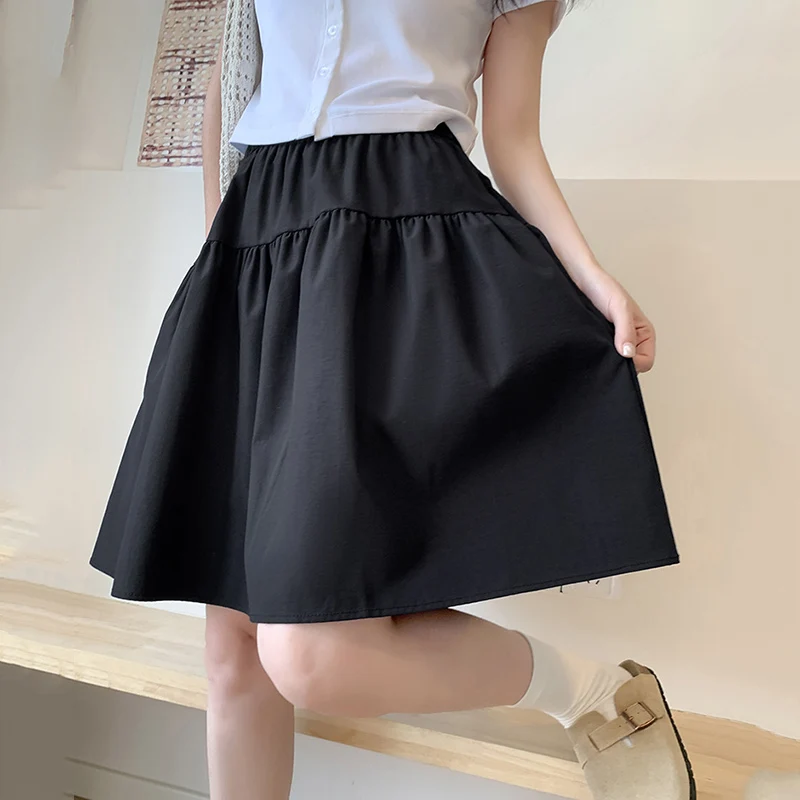 Style collégial ample une ligne jupes femmes été élastique taille haute jupes plissées femme japonais solide au-dessus du genou longueur jupe