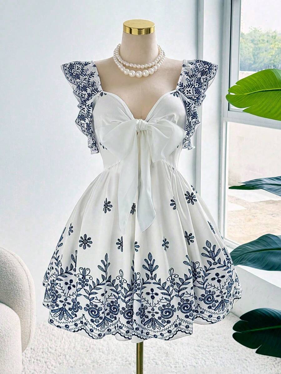 Robe élégante grande taille, imprimé ethnique tendance, design drapé raffiné et sophistiqué
