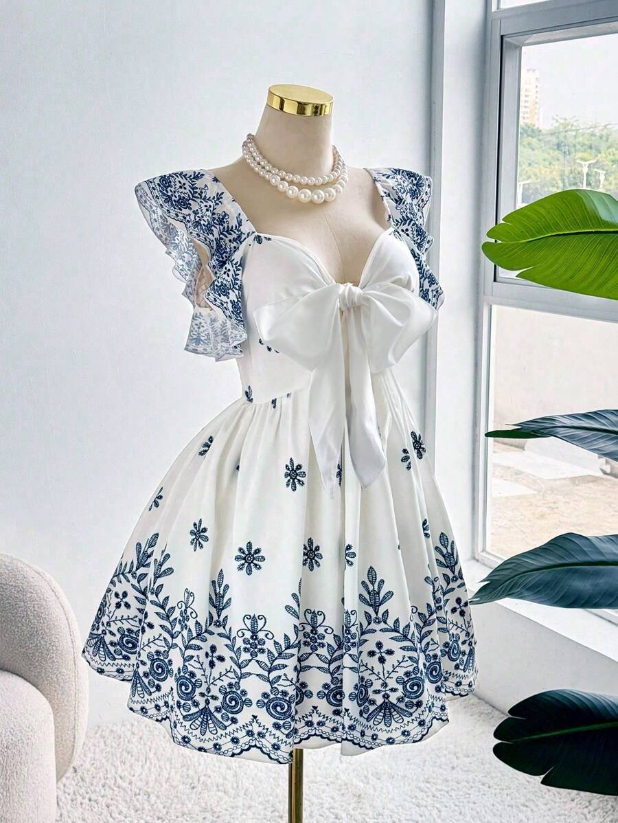 Robe élégante grande taille, imprimé ethnique tendance, design drapé raffiné et sophistiqué
