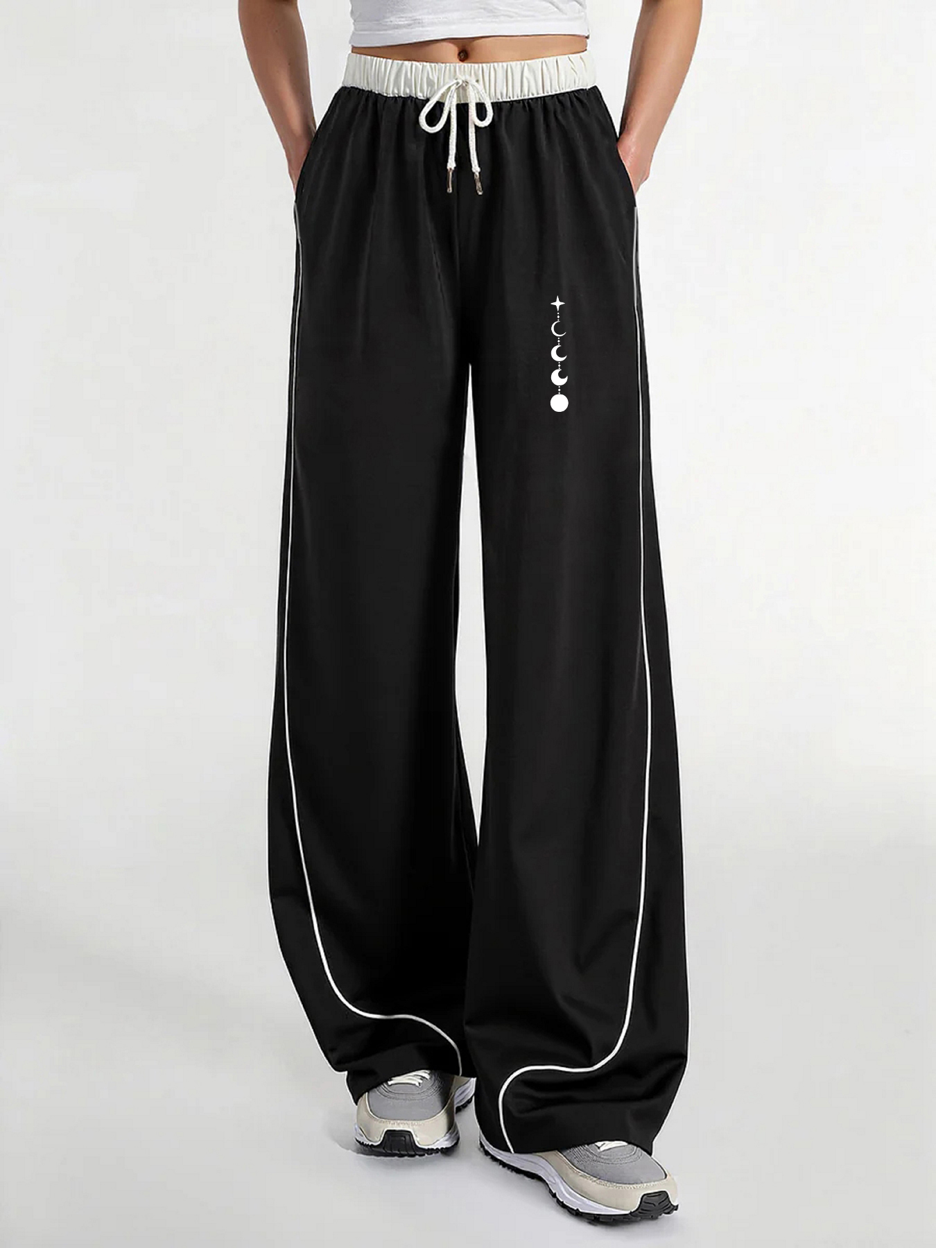 Pantalon décontracté pour femme, un incontournable pour un look tendance, pantalon décontracté d'été à jambe large avec imprimé phases de lune et trajectoire des étoiles, coupe ample avec un tombé fluide, confortable e