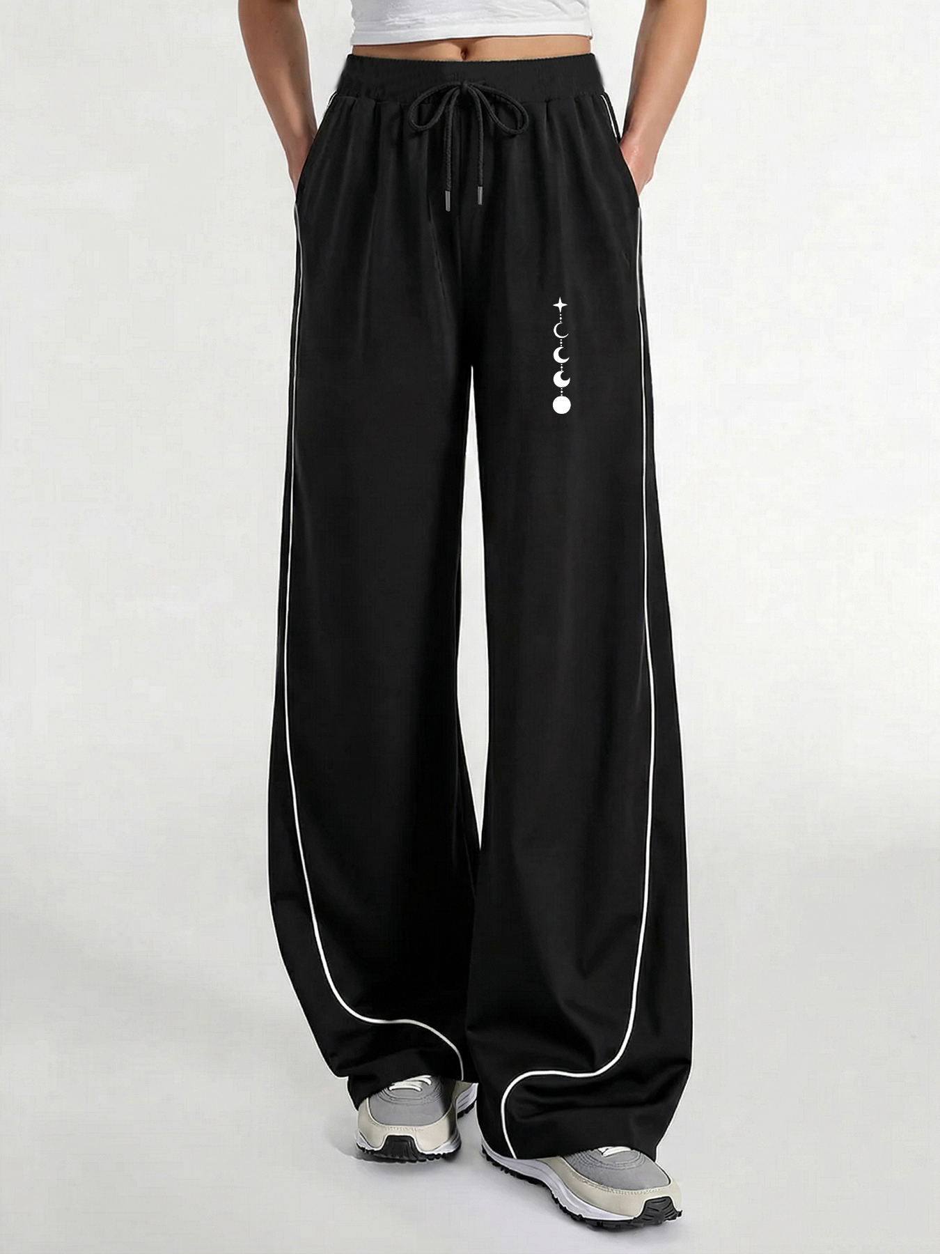 Pantalon décontracté pour femme, un incontournable pour un look tendance, pantalon décontracté d'été à jambe large avec imprimé phases de lune et trajectoire des étoiles, coupe ample avec un tombé fluide, confortable e