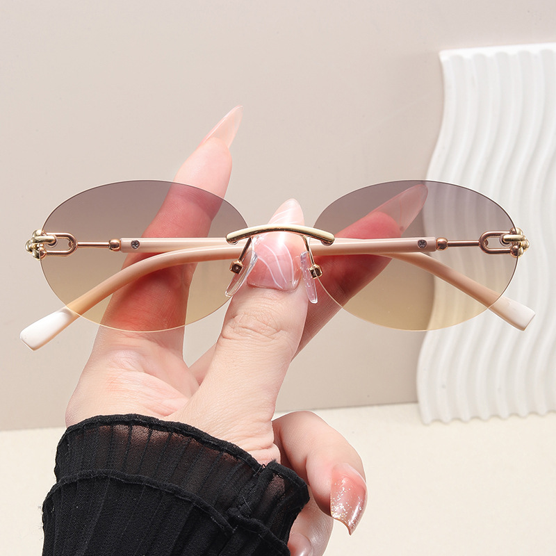 Lunettes de soleil œil de chat rondes sans monture pour femmes, monture circulaire en alliage, élégantes, décontractées, pour le voyage