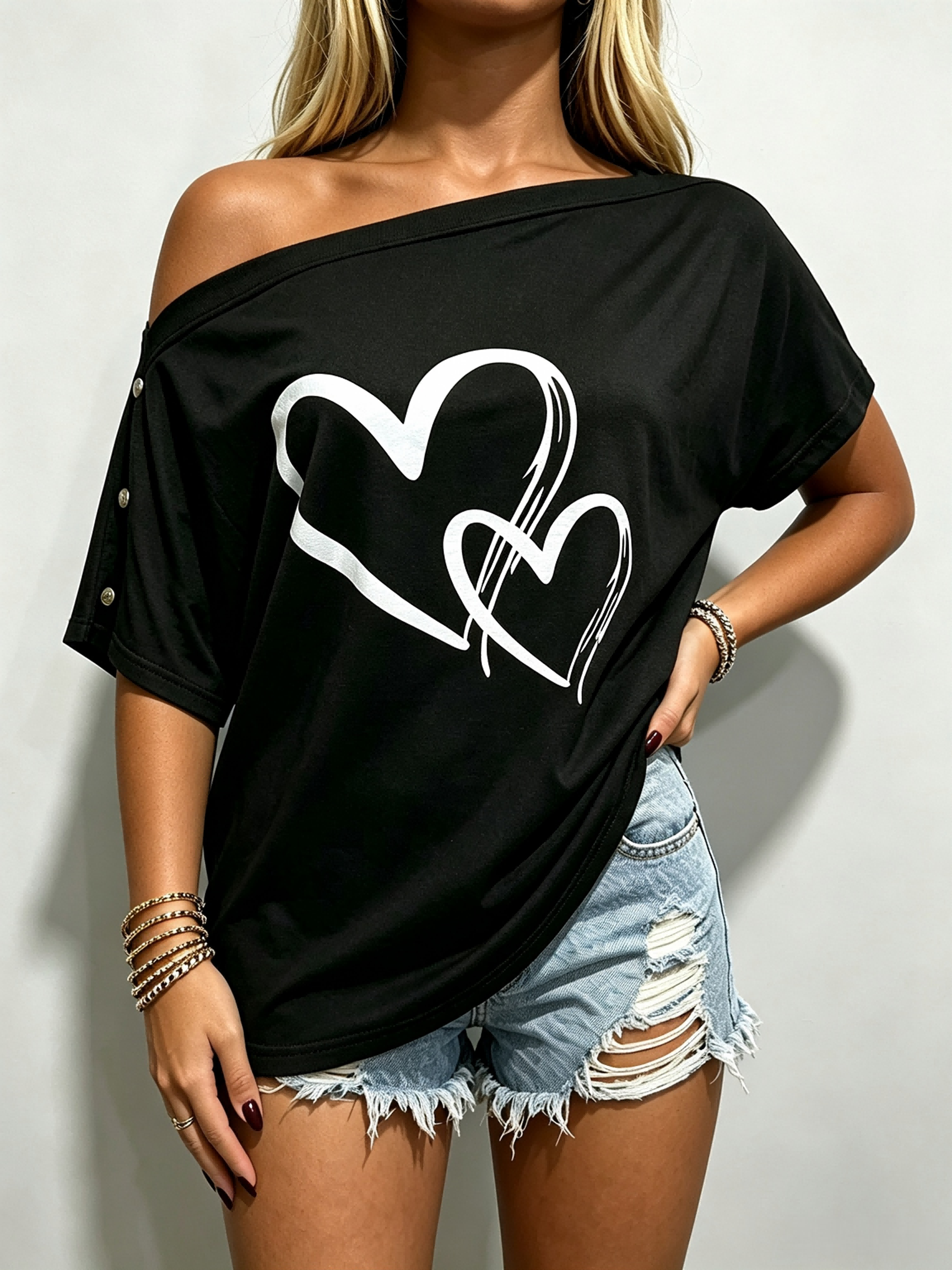 T-shirts d’été pour femmes, motif cœur, coupe ample, idéal pour le quotidien, modèle à épaules dénudées, manches courtes, haut décontracté noir, parfait pour les fêtes et les sorties.