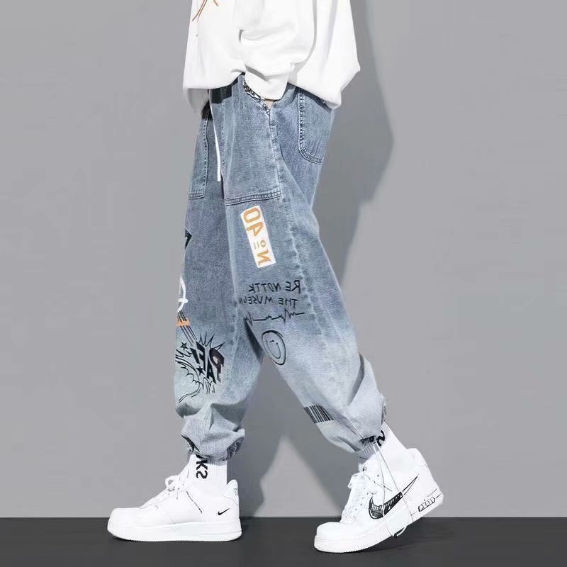 Vêtements coréens hommes lettre imprimé jean taille haute Baggy jean dessin animé Graffiti Hip-Hop pantalon jean bleu