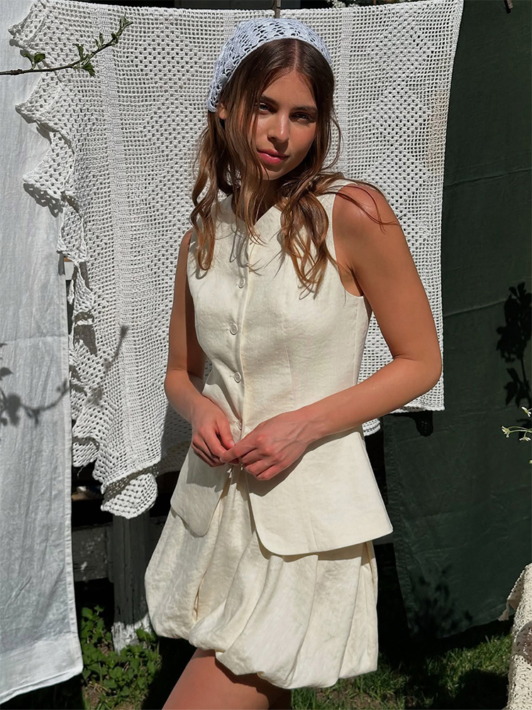 Ensemble 2 pièces pour femme en coton, été 2026, chic et décontracté pour le travail, comprenant un débardeur sans manches et une jupe courte à volants, tenue décontractée pour femme.