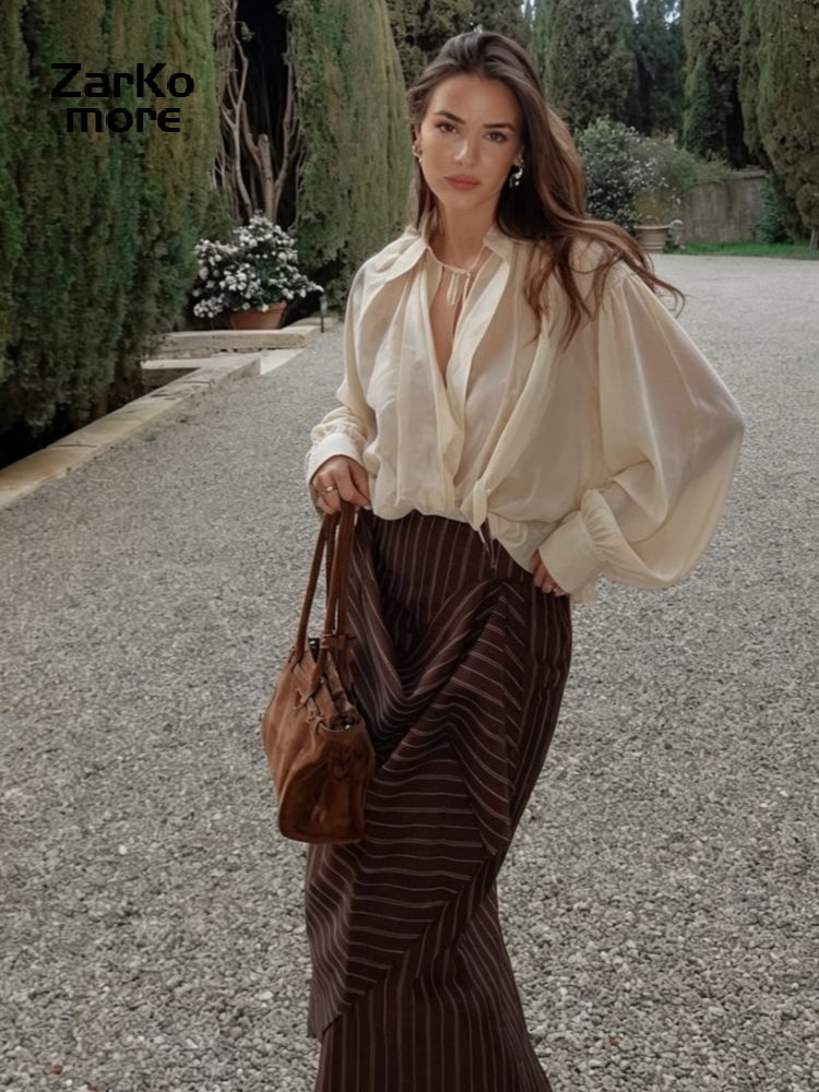 Ensemble chic chemise et jupe pour femme, col à revers ample, décolleté en V profond, manches longues, chemise transparente à lacets, jupes irrégulières à rayures, costumes 2026