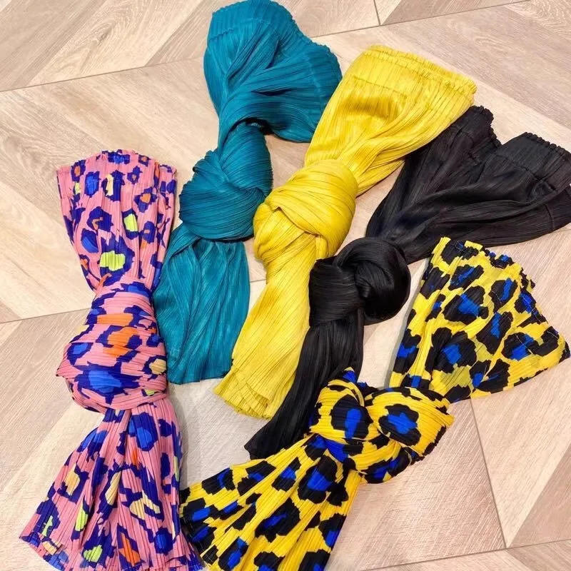 Jupe plissée taille haute pour femme, coupe ajustée, taille élastique, design asymétrique, jupe mi-longue ample en A pour l'été