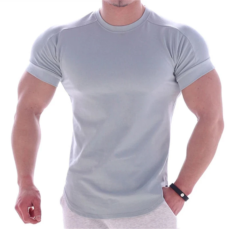 NOUVEAU T-shirt d'été pour hommes, coupe ajustée et très élastique, T-shirt pour hommes à séchage rapide, ourlet incurvé, T-shirts pour hommes, hauts de sport décontractés, couleur unie.