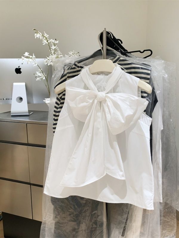 Chemisier blanc élégant pour femme, style été 2026, sans manches, coupe ample, avec nœud et bandage