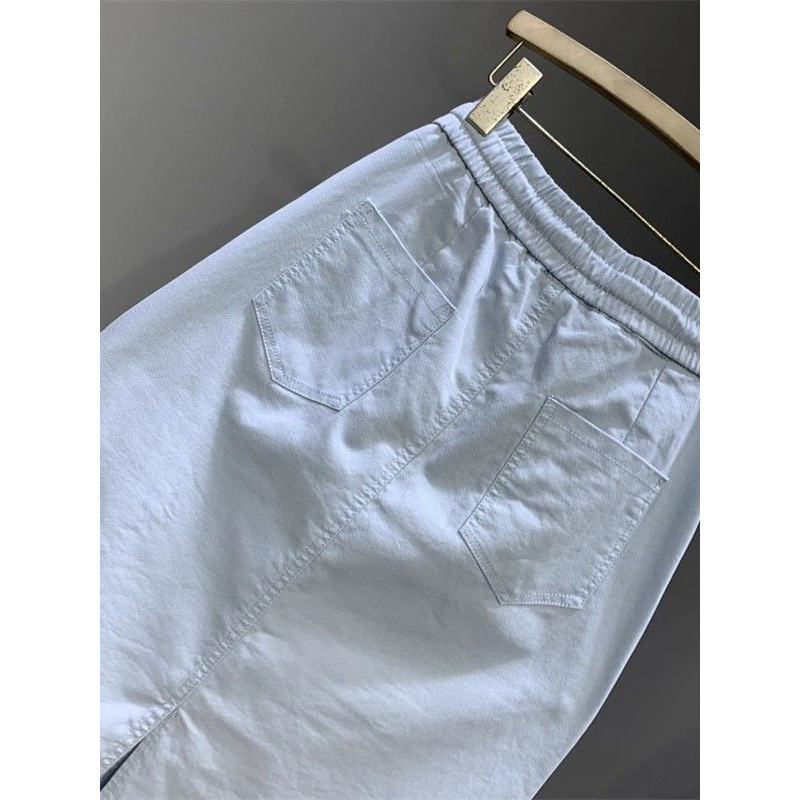 Mode coréenne 2025 nouvelle jupe d'été femmes décontracté sauvage taille haute Simple mi-longue fendue a-ligne jupe mince dames vêtements