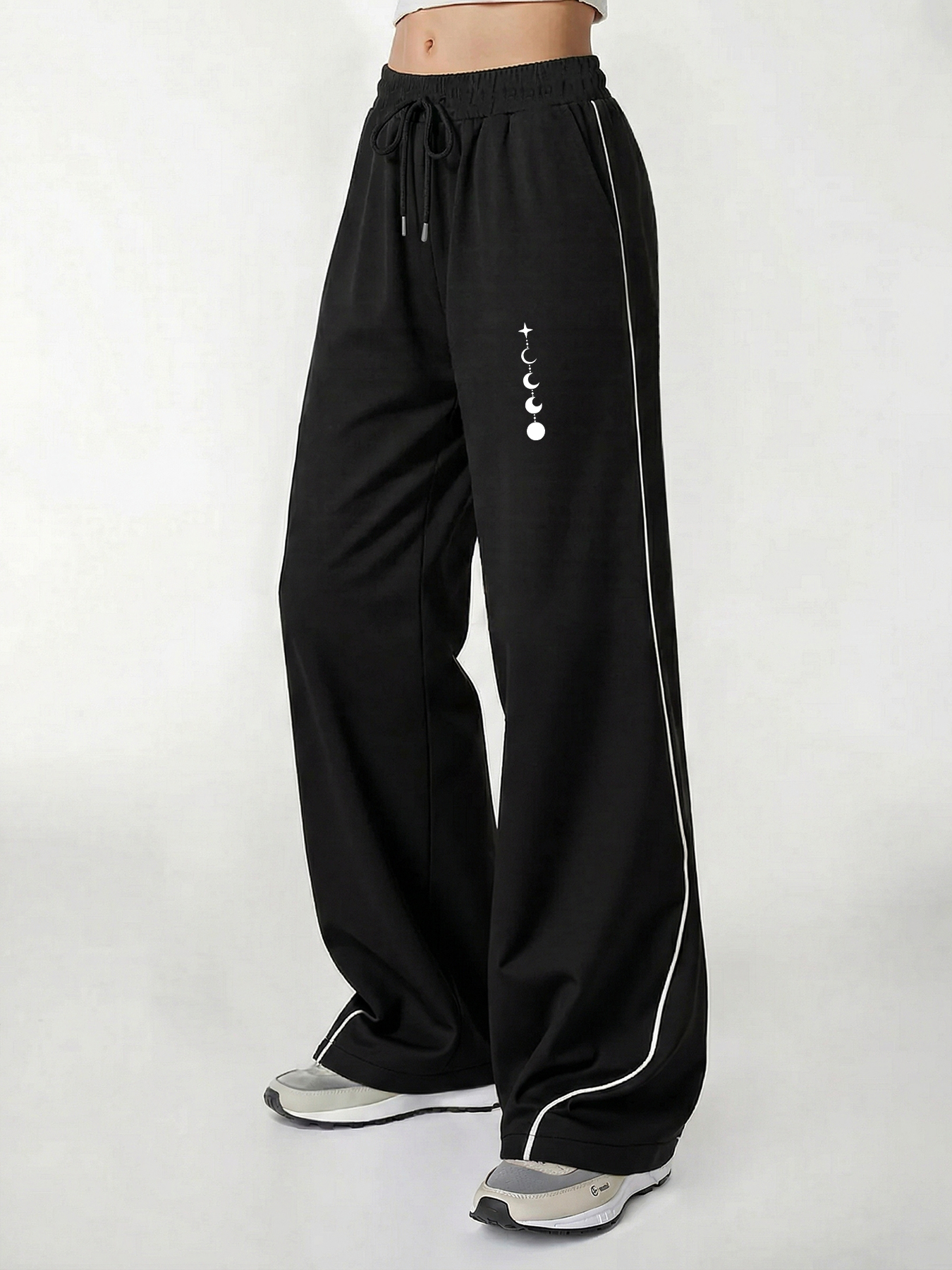 Pantalon décontracté pour femme, un incontournable pour un look tendance, pantalon décontracté d'été à jambe large avec imprimé phases de lune et trajectoire des étoiles, coupe ample avec un tombé fluide, confortable e