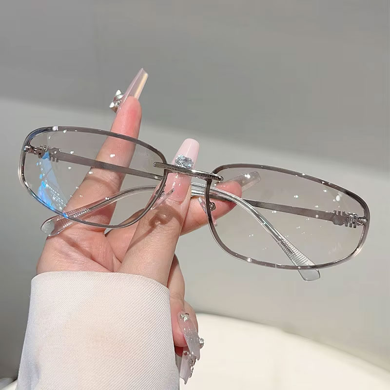 Lunettes de soleil ovales sans monture pour femme, style rétro tendance, idéales pour les voyages et les photos de rue, lunettes de soleil tendance pour homme.