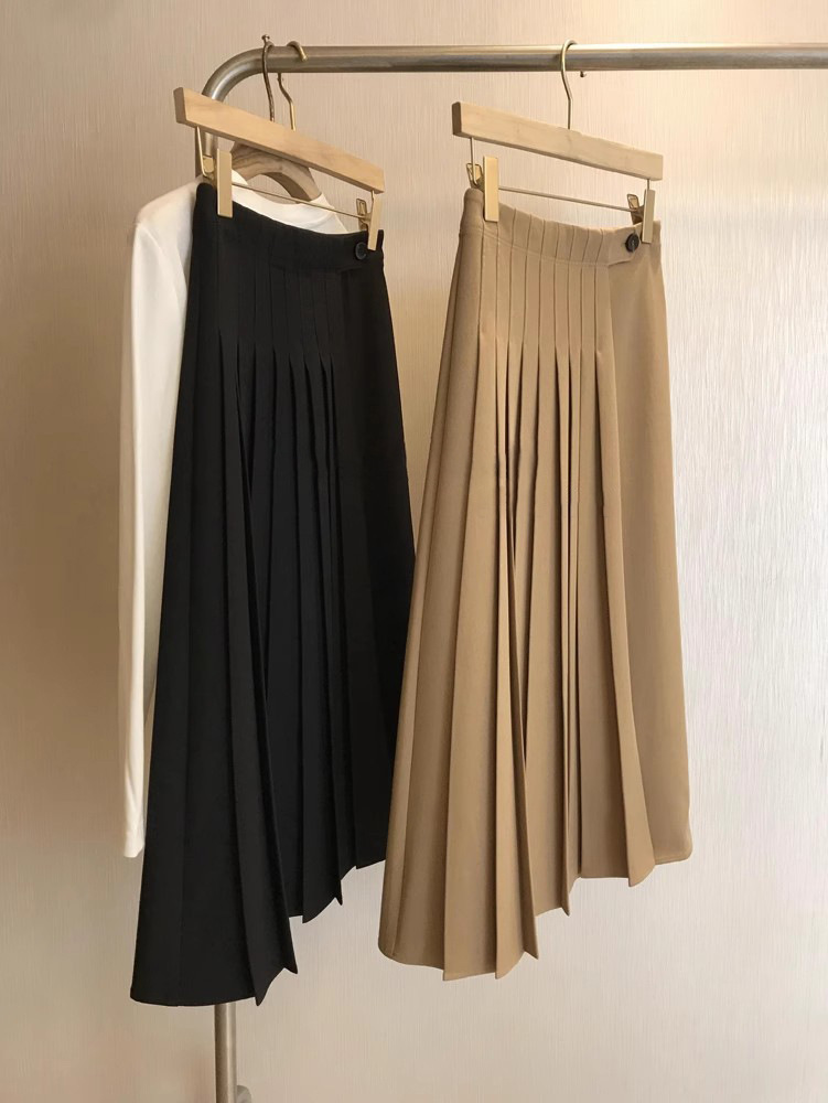 Jupe mi-longue plissée à taille haute de couleur unie décontractée pour femmes printemps-automne