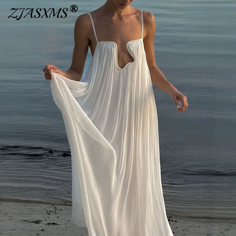 Robes pour femmes Printemps 2026, Robe longue maxi de soirée style bohème, col en U, avec décorations métalliques, ajourée, dos nu, unie, ample, à bretelles, pour l'été, Vestido