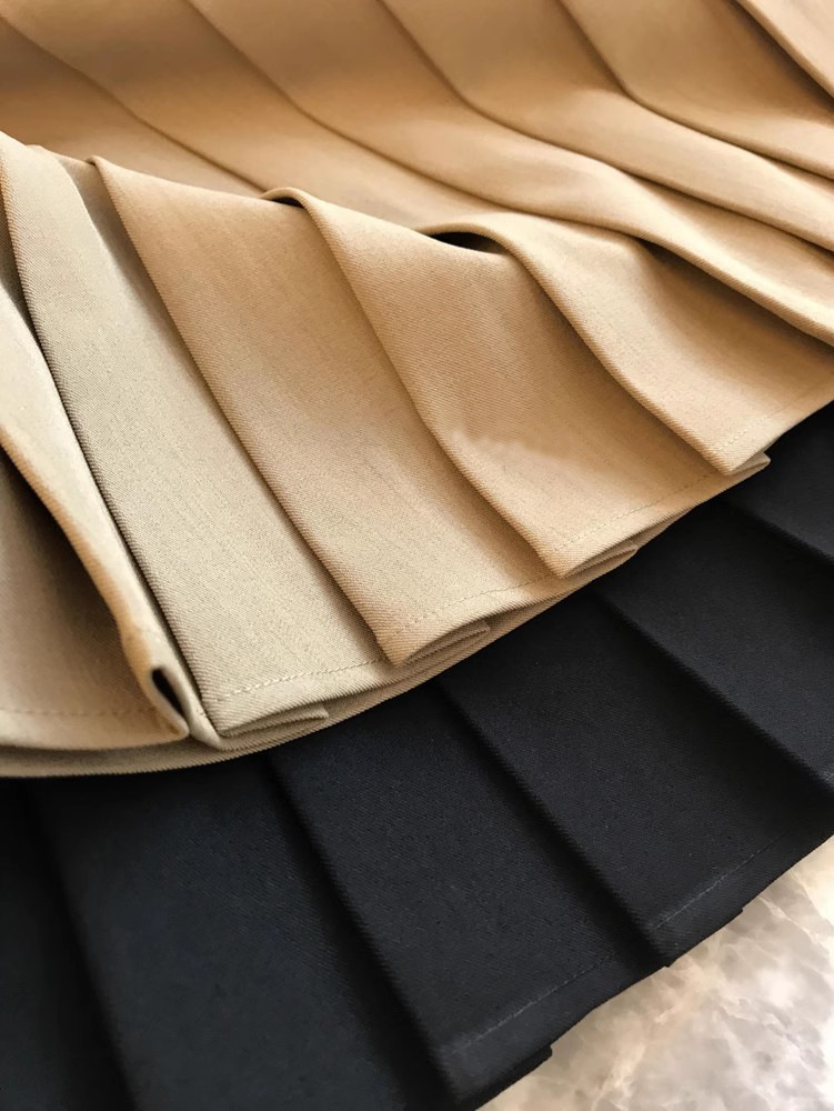 Jupe mi-longue plissée à taille haute de couleur unie décontractée pour femmes printemps-automne