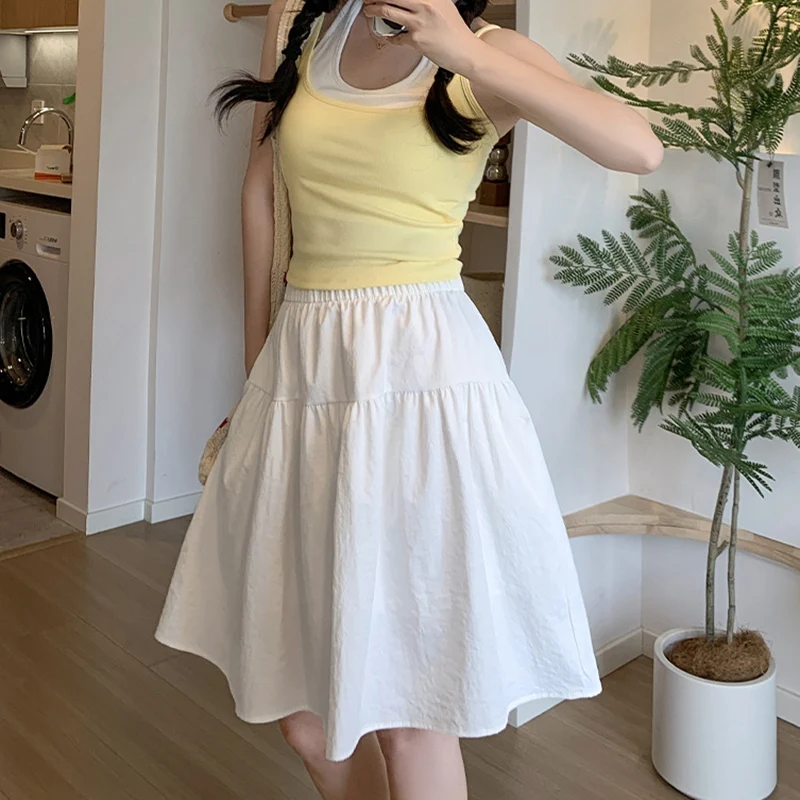 Style collégial ample une ligne jupes femmes été élastique taille haute jupes plissées femme japonais solide au-dessus du genou longueur jupe