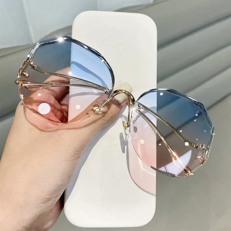 Lunettes de soleil de luxe UV400 pour femmes, verres d'océan, sans bords, branches incurvées en métal, unisexe
